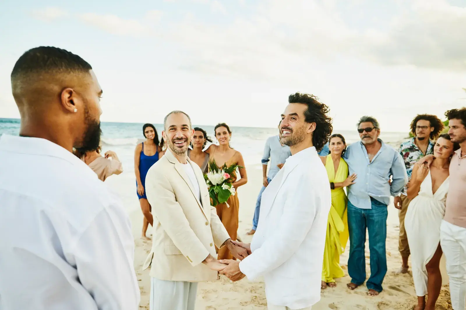 Intimate beach wedding ceremony with close family